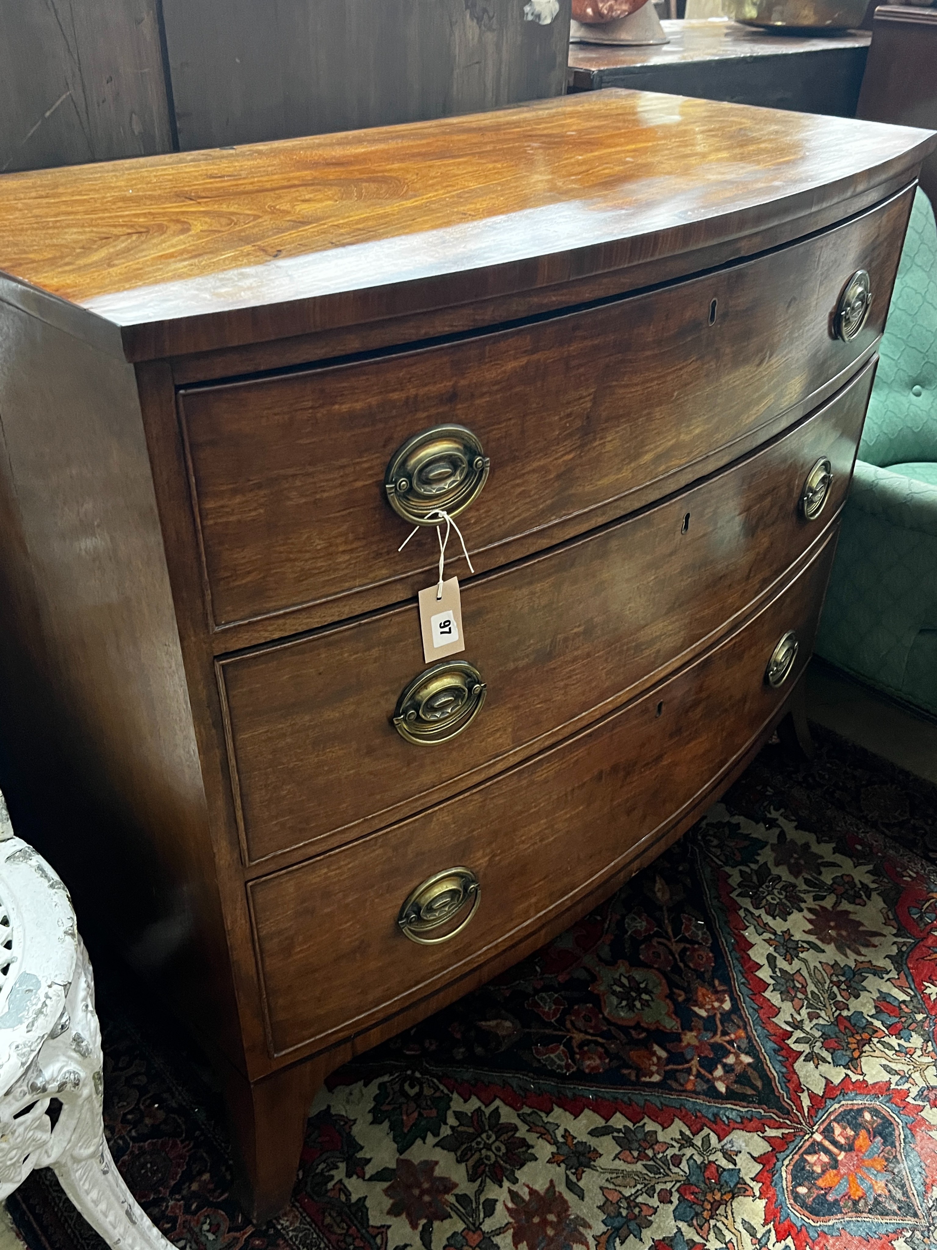 A Regency mahogany bow fronted chest of three long graduated drawers, width 100cm, depth 53cm, height 89cm